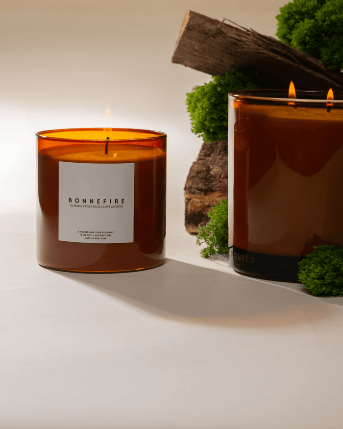 Poured New York Bonnefire candles lit, with moss and wood