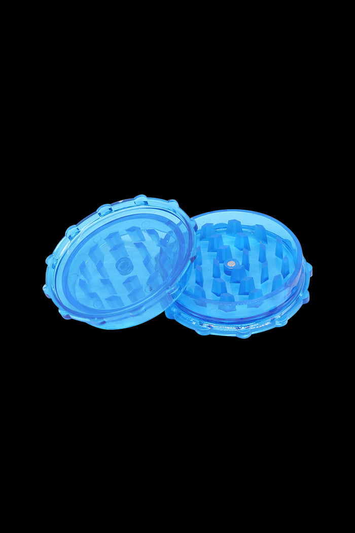 Blue cannabis grinder with two clear acrylic halves.