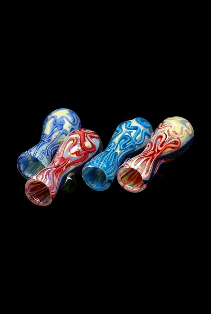 Angled front view of four colorful Brain Fold Chillum Pipe handblown glass chillums with swirling red, blue, yellow patterns on black.
