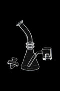 Clear glass dab rig with a quartz banger and carb cap, isolated on a black background.