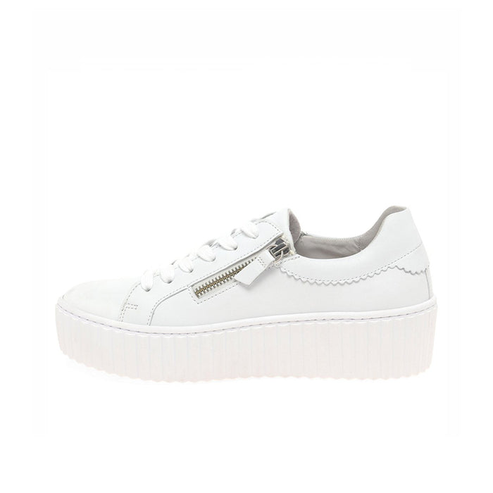 Women’s white leather sneakers with lace-up front and silver side zipper, platform sole