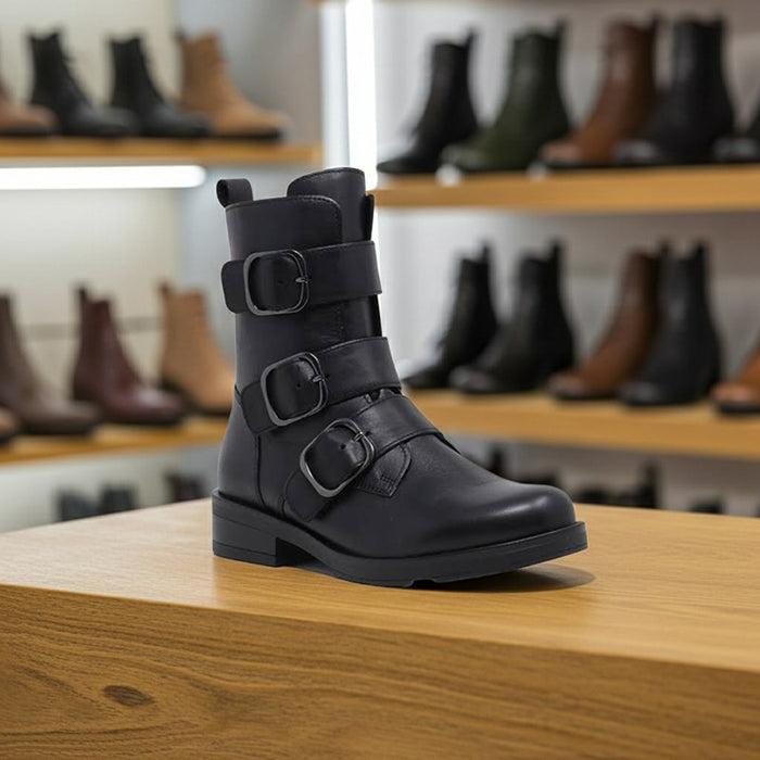 Black leather ankle boot with two buckled straps and rounded toe