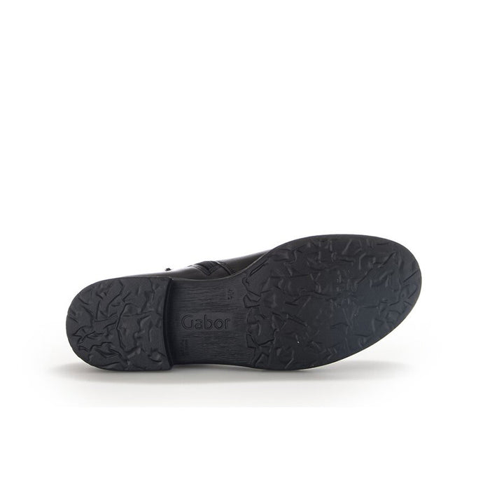 Black leather ankle boot outsole view with textured tread sole
