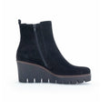 Black leather ankle boots with side zip and chunky lug sole