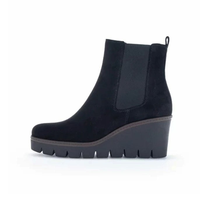 Black leather Chelsea-style boots with elastic panels and wedge lug sole