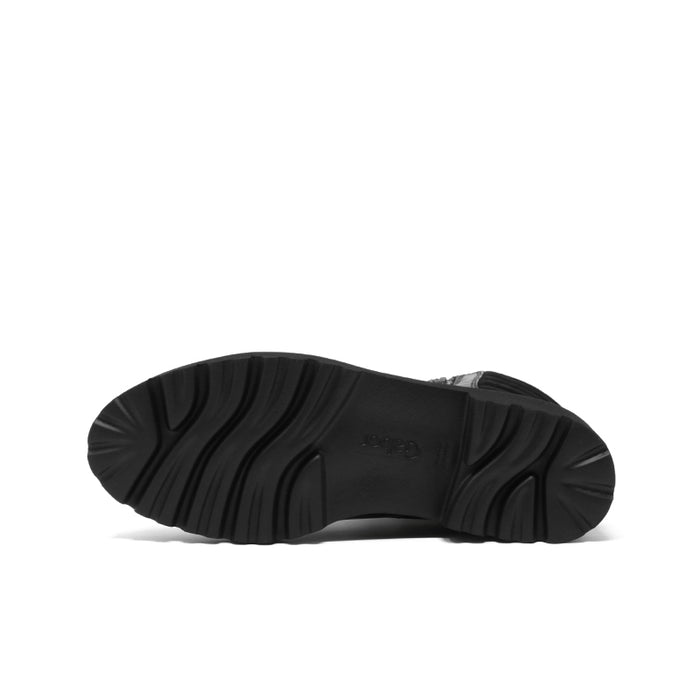 Black boot outsole with textured tread and brand logo on heel