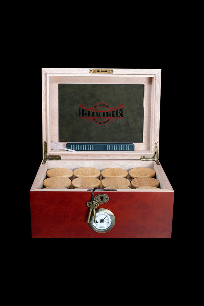 Wooden cannabis storage box with humidity gauge and filter stones.