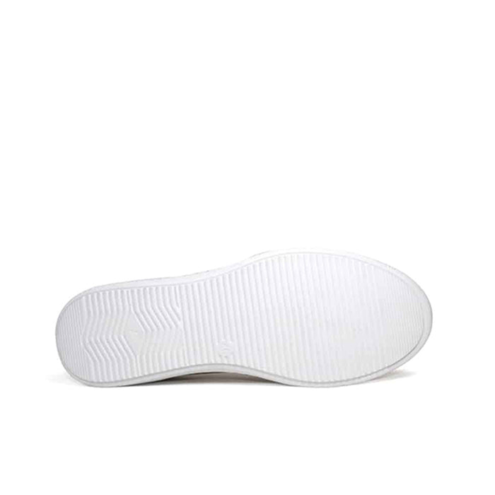 White outsole view of brown leather slip-on sneakers with textured tread