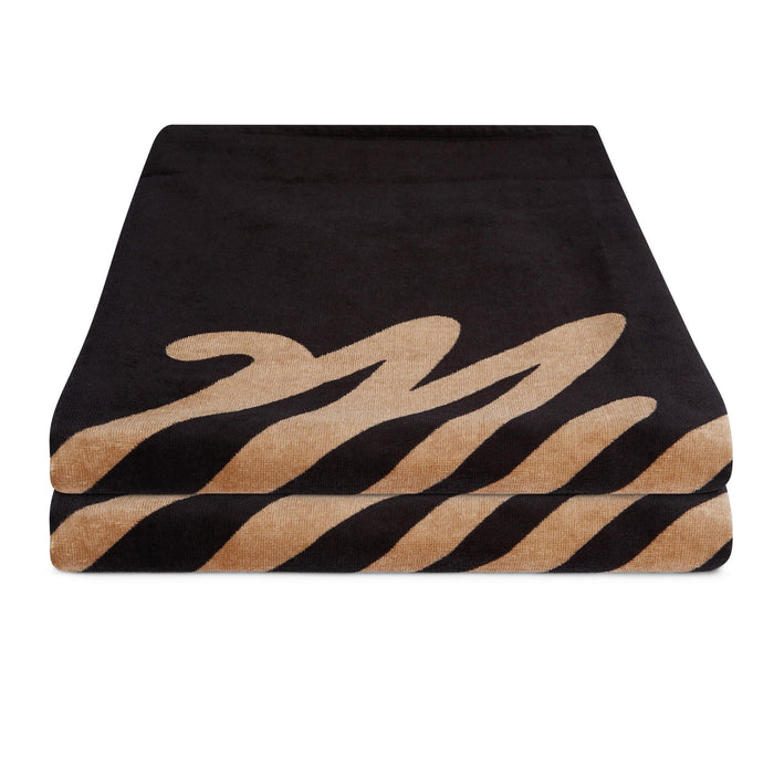 Mystic Quick Dry Black Terry Towel, folded, with tan wave design, beach towel