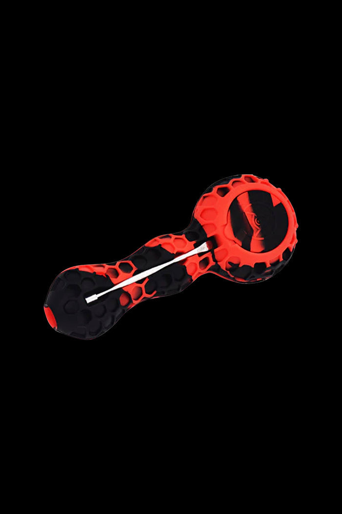 Red and black silicone cannabis pipe with skull design.