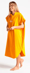 Robie Original Changing Robe in bright orange, hooded, worn by a woman, front view