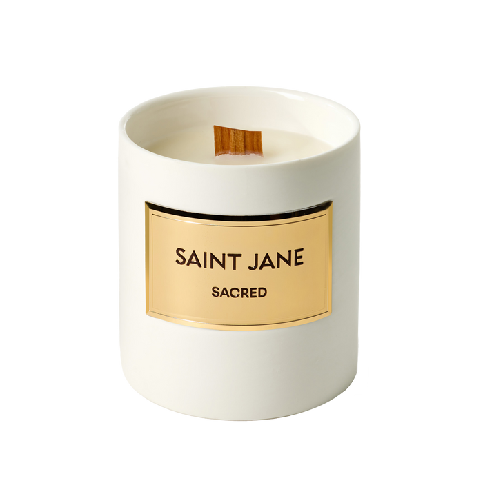 Saint Jane Sacred Candle in a white ceramic vessel with an engraved gold plate